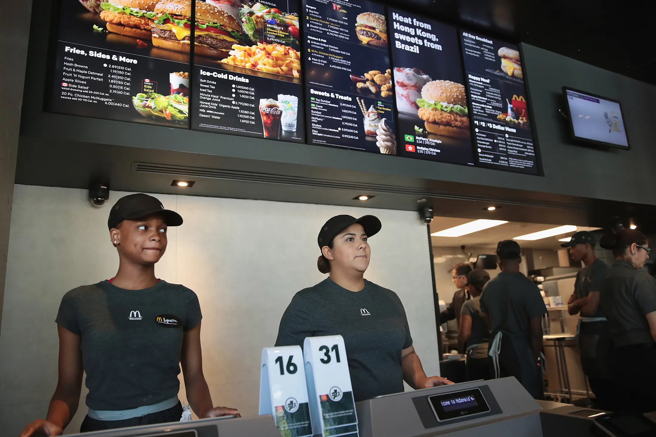 Employees work the counter at a McDonald’s restaurant. 