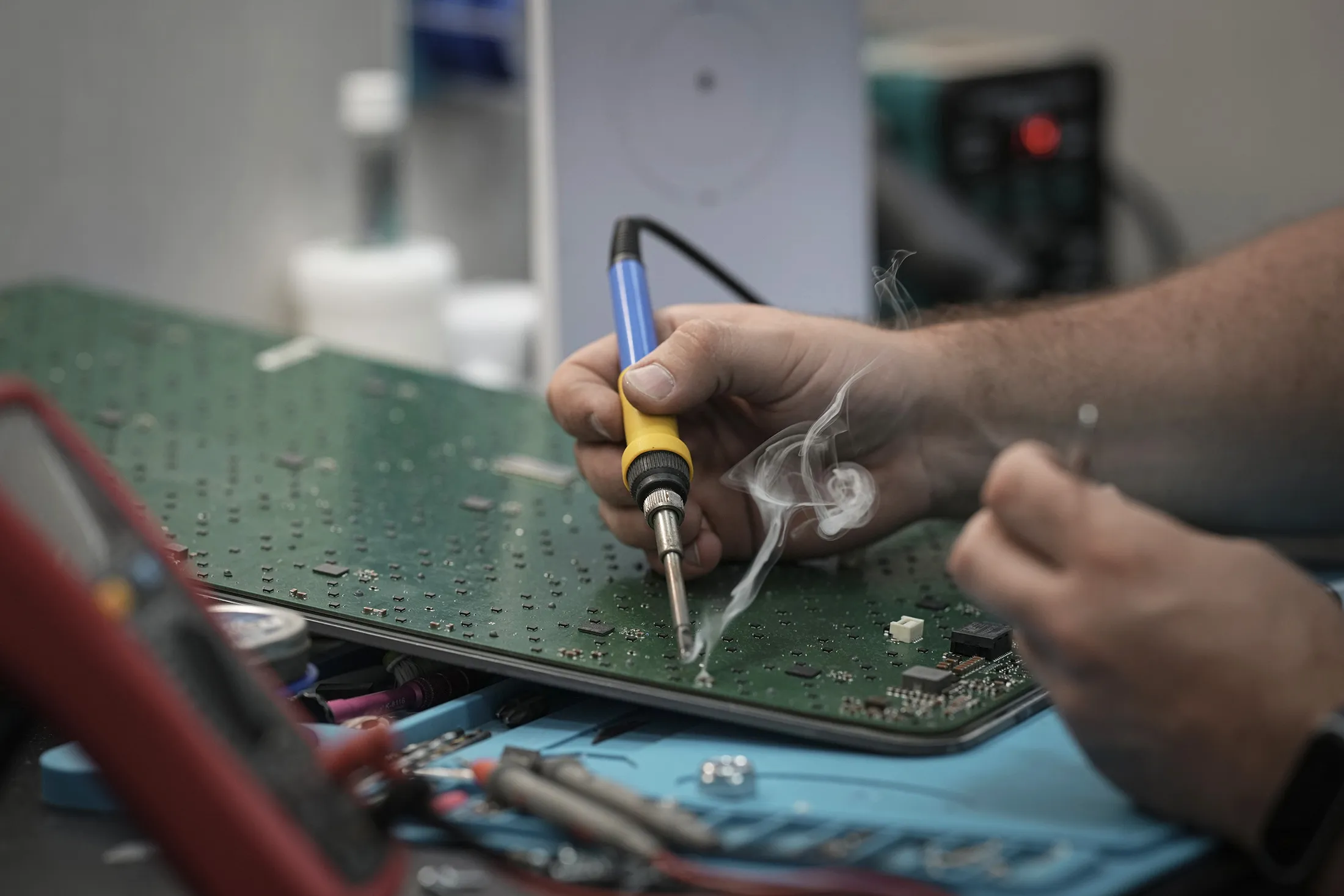 A worker of Stetman LLC repairs damaged Starlink terminal in an undisclosed location in Ukraine, on July 14, 2025.