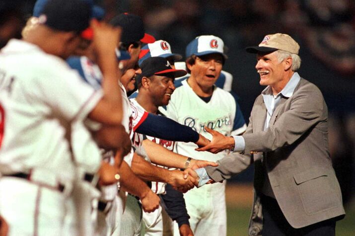 Atlanta Braves owner Ted Turner shakes hands with