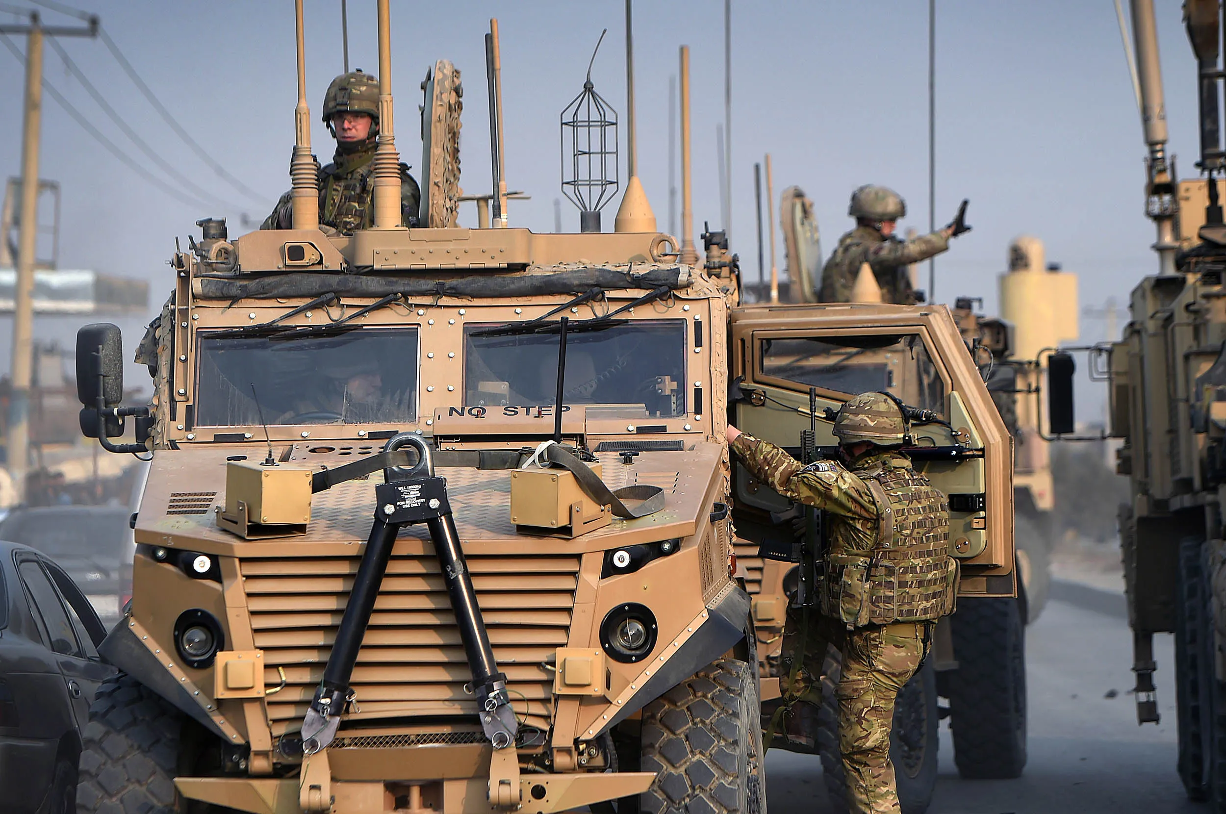 U.S. soldiers arrive at the scene following a suicide car bomb attack on a European Union police vehicle along the Kabul-Jalalabad road on Jan. 5, 2015.
