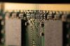 Memory chips are seen on a Toshiba Corp. memory module in this arranged photograph taken in Tokyo, Japan, on Sunday, Feb. 19, 2017. To stay afloat, Toshiba says it may have to sell a majority stake in its last remaining crown jewel: its flash-memory business.