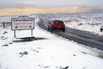 Cars navigating fresh snowfall on the A689 Road near Nenthead in Northumberland, as high winds are due to batter the UK.