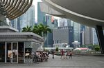 People sit outside a restaurant in Singapore on Jan. 3.