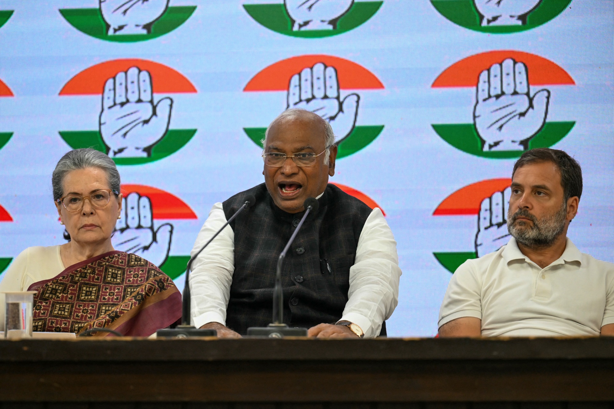 India’s Congress party president Mallikarjun Kharge, center, with Sonia Gandhi, left, and Rahul Gandhi at the Congress party headquarters in New Delhi on March 21.