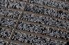 New automobiles covered in protective wrapping sit on the dockside at the Port of Tilbury, operated by Forth Ports Plc, in this aerial photograph taken over Tilbury, U.K., on Wednesday, July 22, 2015. British manufacturers are struggling to build exports because of the unfavorable exchange rate and uncertainty in the euro area, the Confederation for British Industry said.