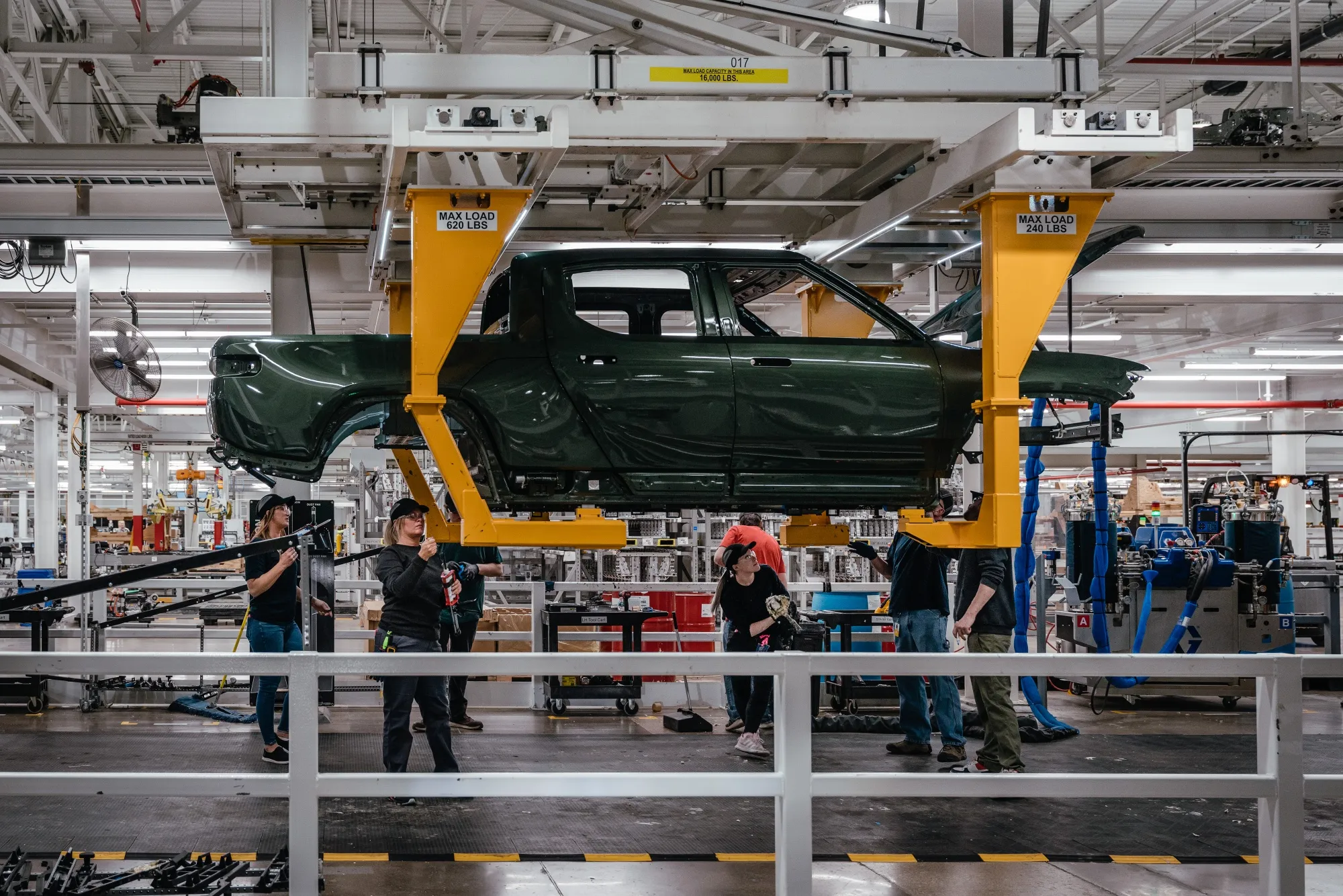 Workers assemble&nbsp;components of an electric vehicle pickup truck in Normal, Illinois.