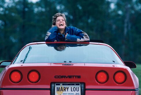Olympic gymnast Mary Lou Retton, here at 16, with her Chevrolet Corvette in 1984.