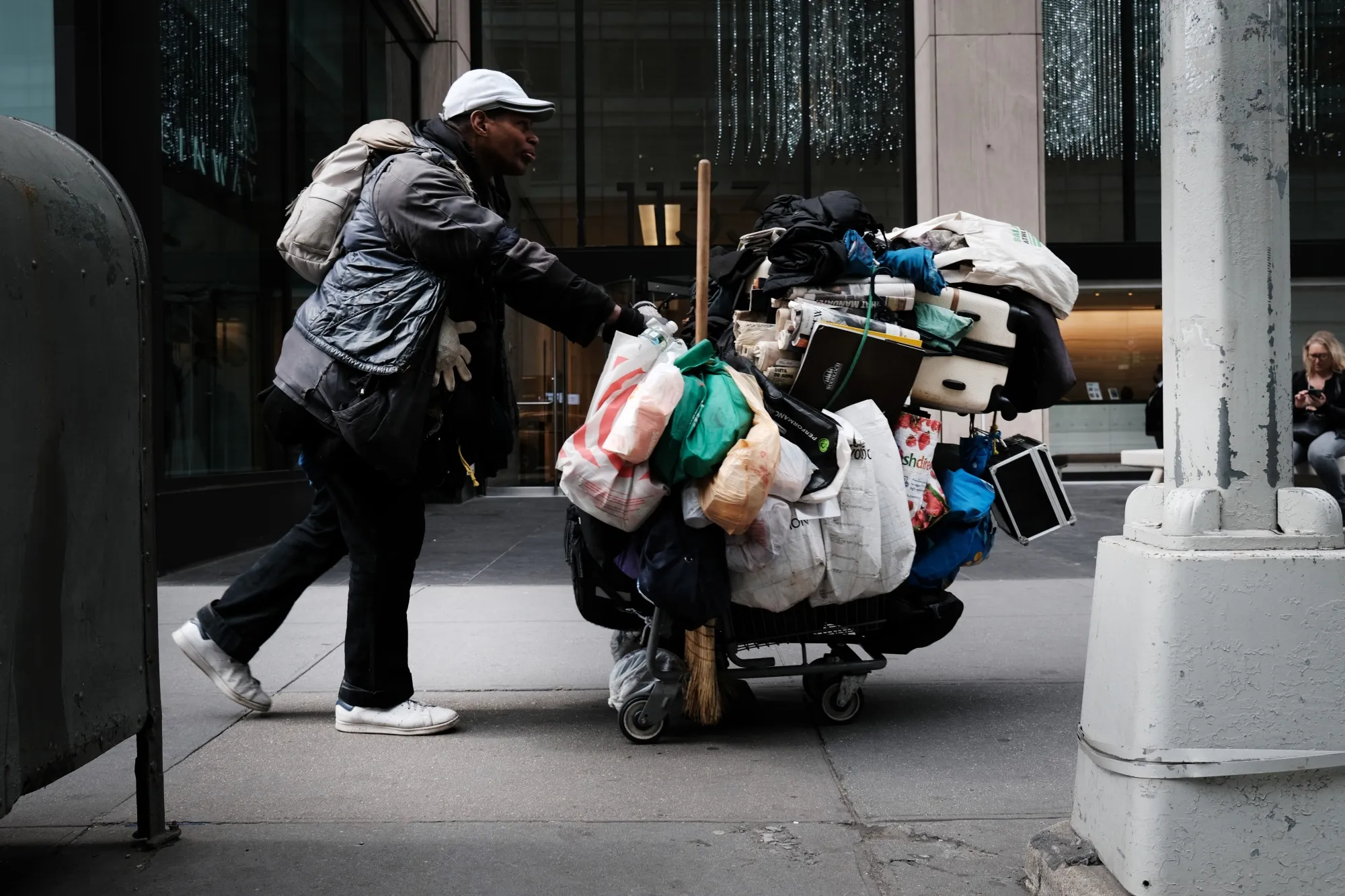 A homeless man walks through Manhattan on March 31.