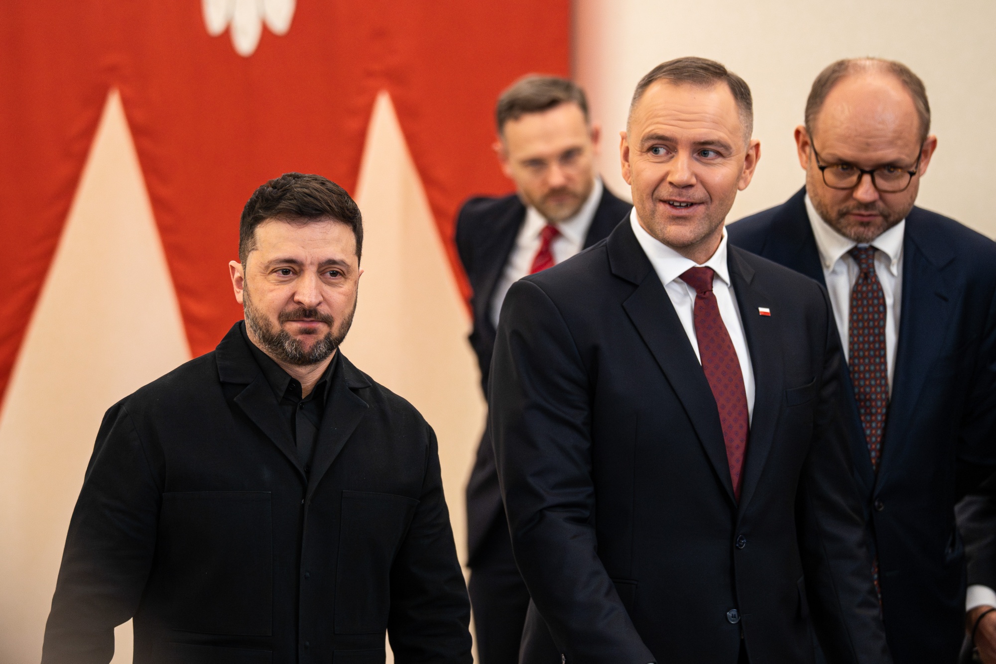 Karol Nawrocki, Poland's president, right, and Volodymyr Zelenskyy, Ukraine's president, arrive at a news conference at the Presidential Palace in Warsaw, Poland, on Friday, Dec. 19, 2025. At a pivotal summit in Brussels, European leaders agreed to provide Ukraine with a 90 billion euros loan to support its military and economic needs over the next two years. Photographer: Damian Lemanski/Bloomberg