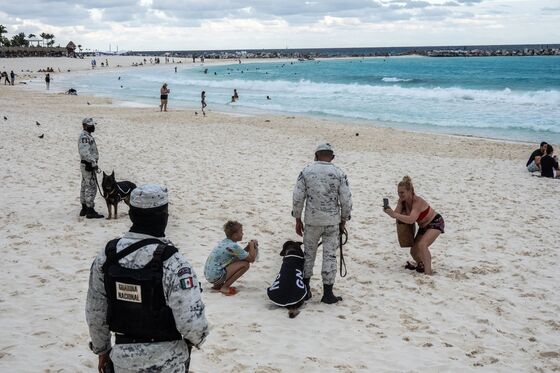 Sand and Soldiers Mix as Troops Move In to Protect Cancun Tourists