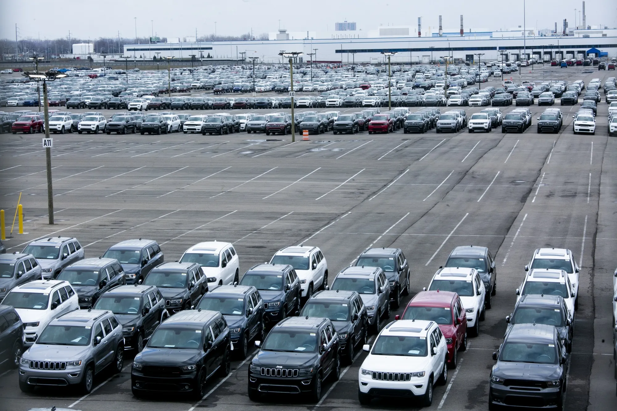New vehicles sit parked outside the idled Fiat Chrysler Jefferson North Plant in Detroit on March 23.