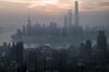 TOPSHOT - A general view shows the sun rising over the financial district of Pudong in Shanghai on September 9, 2016. / AFP / FRED DUFOUR (Photo credit should read FRED DUFOUR/AFP/Getty Images)