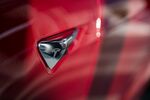 The Tesla logo on the side-view camera of Model S sedan.