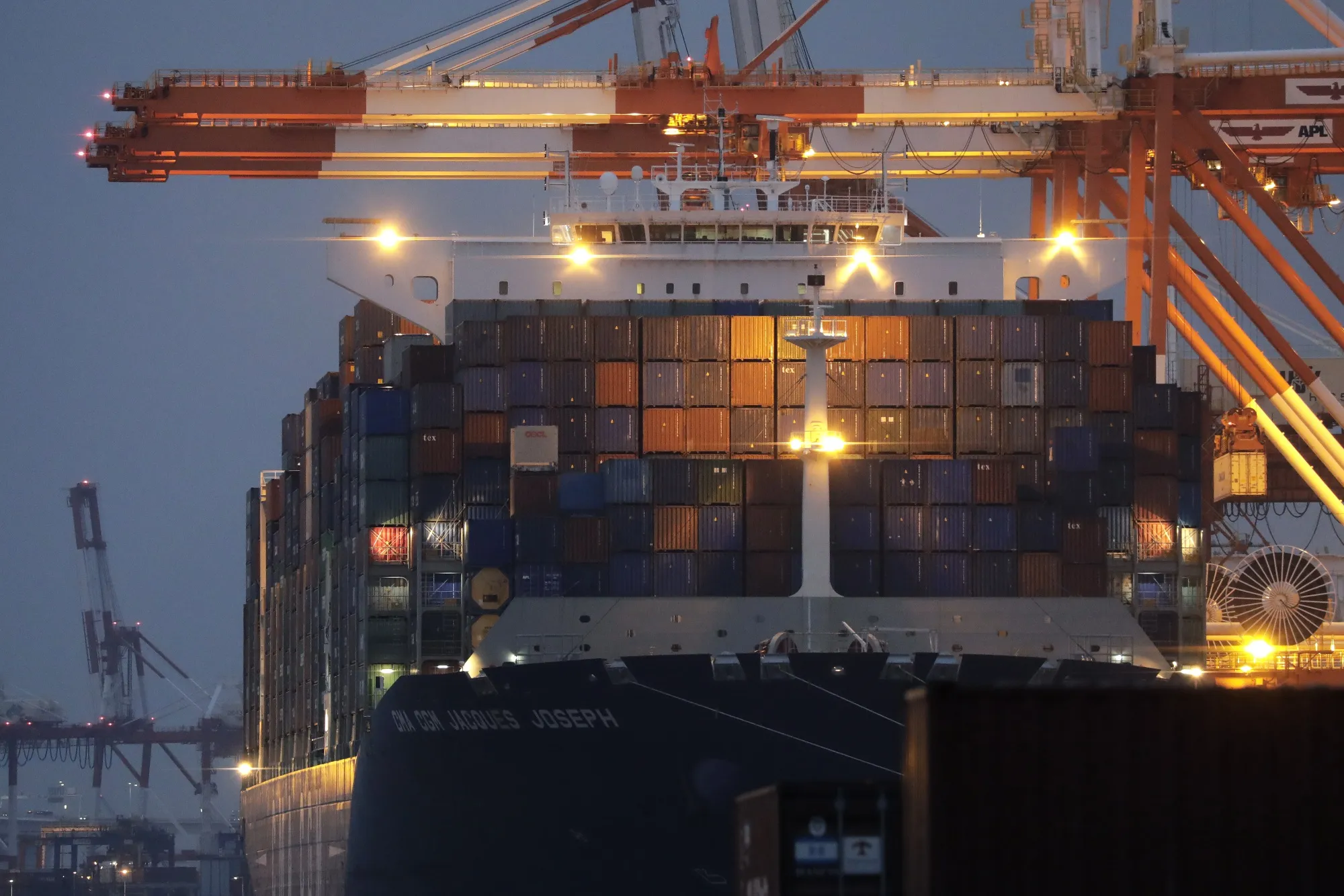 Containers sit stacked on a container ship in Yokohama.