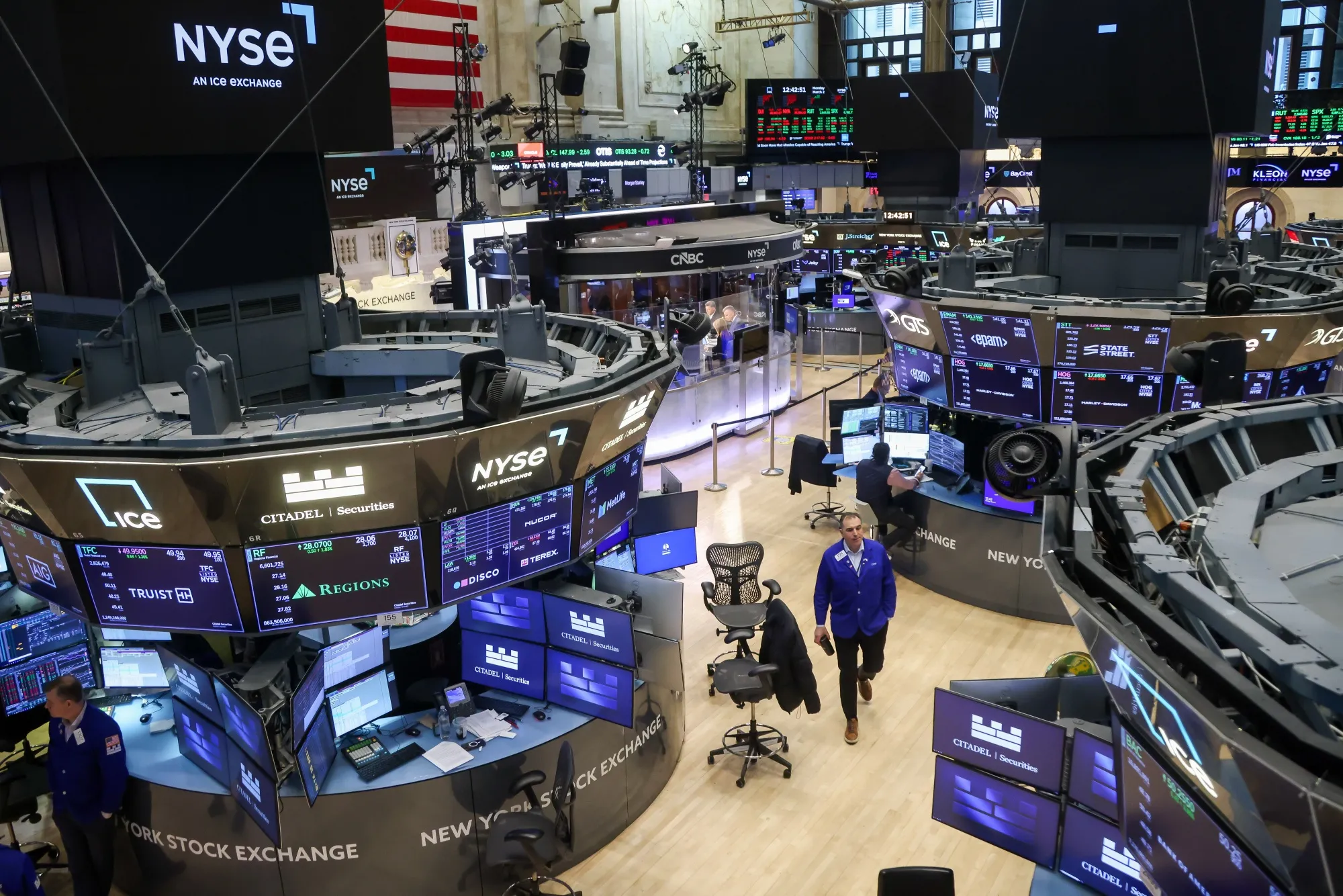 Traders work on the floor of the New York Stock Exchange