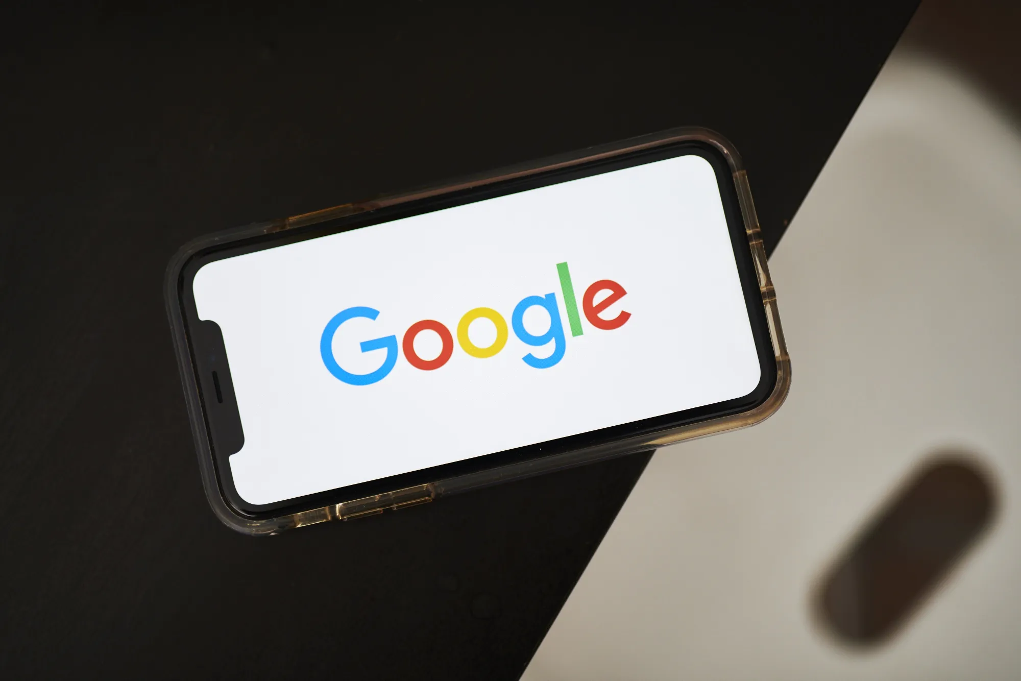 The Google logo on an iPhone.