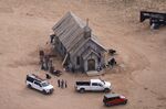 This aerial photo shows part of the Bonanza Creek Ranch film set in Santa Fe, N.M., on Saturday, Oct. 23, 2021, where cinematographer Halyna Hutchins died from a gun fired by actor Alec Baldwin. The family of a cinematographer shot and killed by Alec Baldwin on the set of the film “Rust” has agreed to settle a lawsuit against Baldwin and the movie's producers, and production will resume on the project. (AP Photo/Jae C. Hong, File)