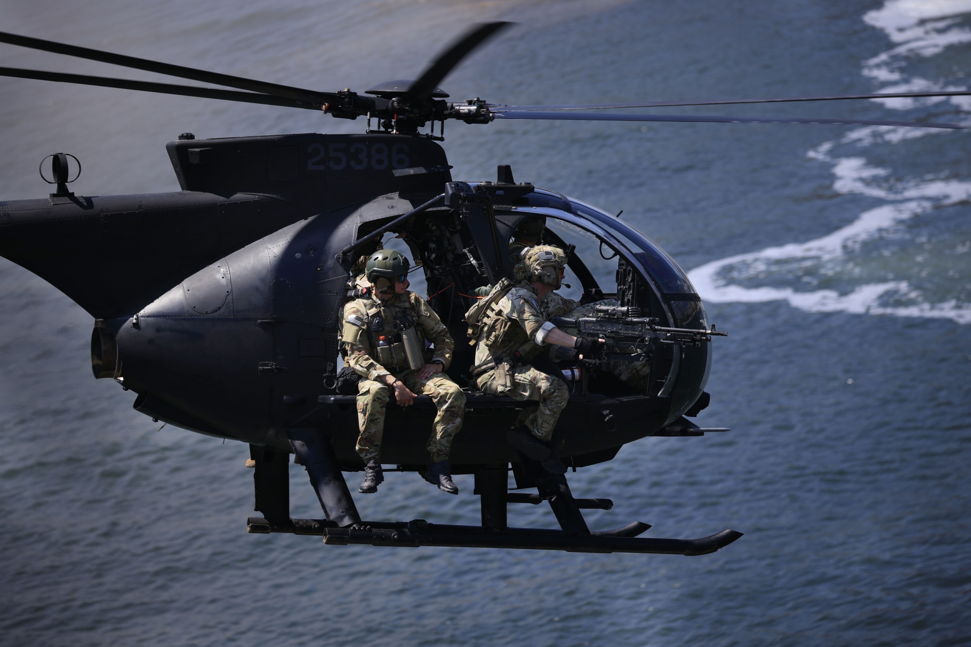 An MH-6 Little Bird helicopter, piloted by members of the U.S. Army's 160th Special Operations Aviation Regiment (SOAR), flies overhead during a capabilities demonstration on May 8, 2024 in Tampa, Florida.