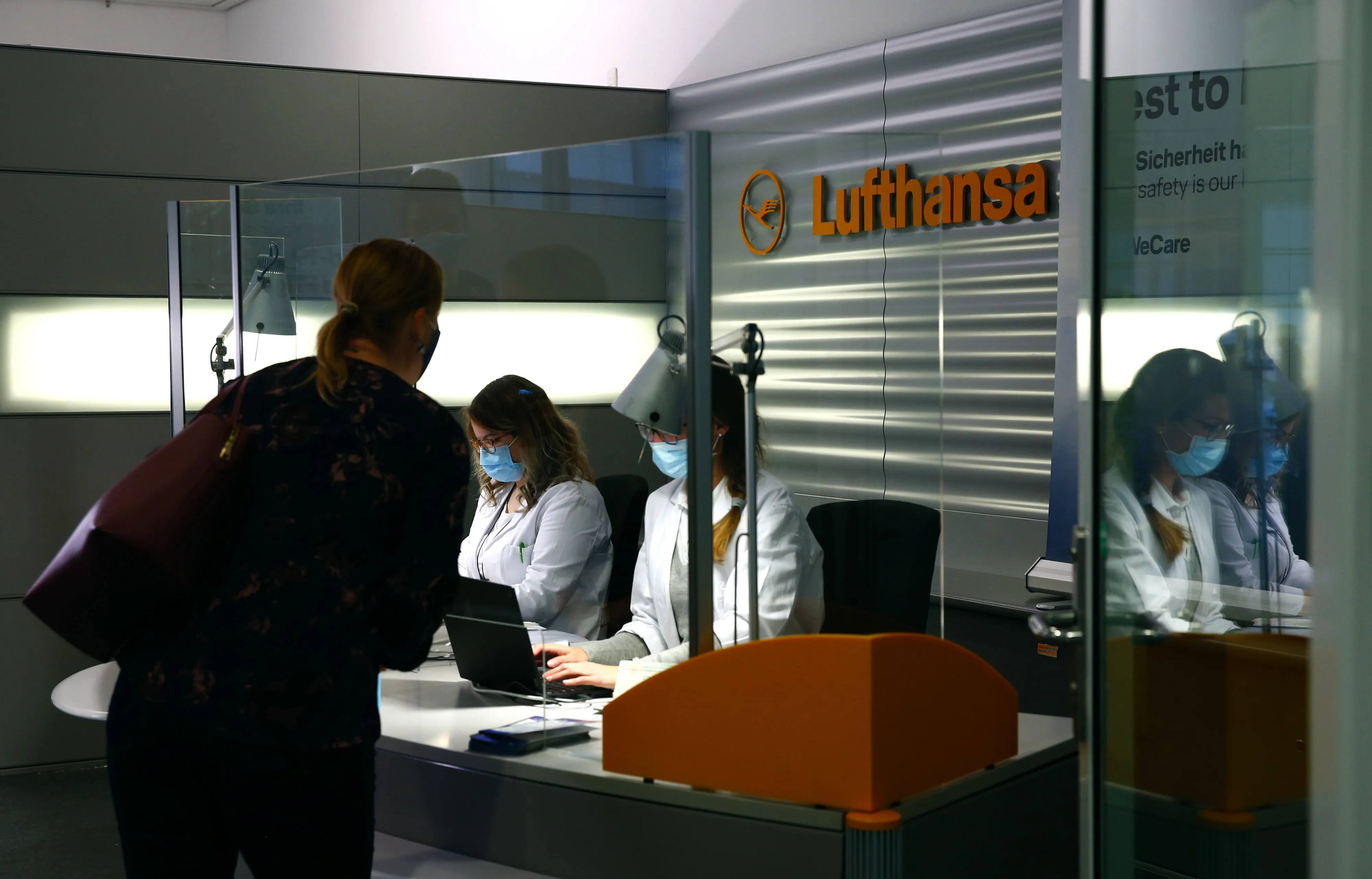 A traveler checks in at the Deutsche Lufthansa AG Covid-19 pre-flight testing center in Munich Airport&nbsp;during the pandemic.&nbsp;