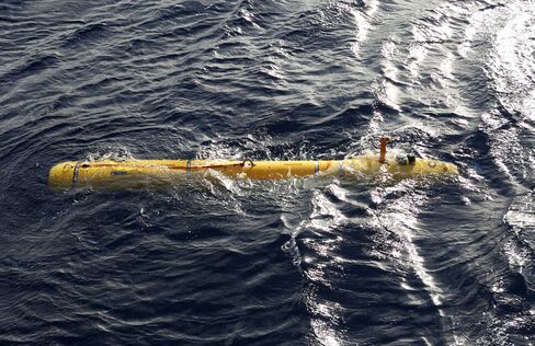 In this handout image provided by Commonwealth of Australia, Department of Defence, Phoenix Autonomous Underwater Vehicle (AUV) Bluefin-21 is in the water after being craned over the side of Australian Defence Vessel Ocean Shield to begin using its side scan sonar in the search for the missing Malaysia Airlines flight MH370 on April 14, 2014.