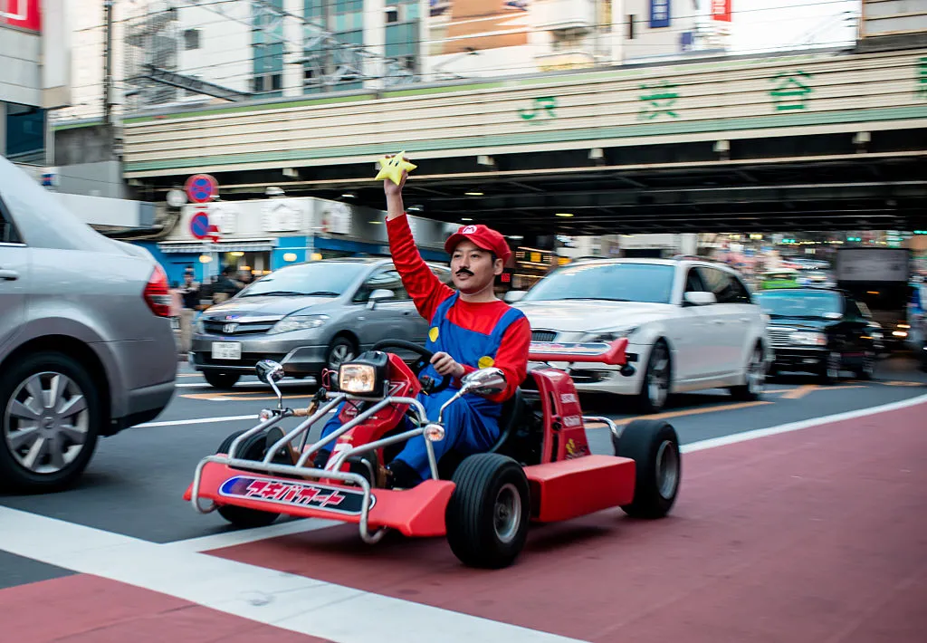 Person in Mario costume drives around Tokyo at a go-kart&nbsp;event&nbsp;in&nbsp;2014.&nbsp;