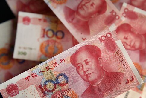 Stocks Boards And Chinese Yuan Banknotes As China Devalues Yuan By Most In Two Decades