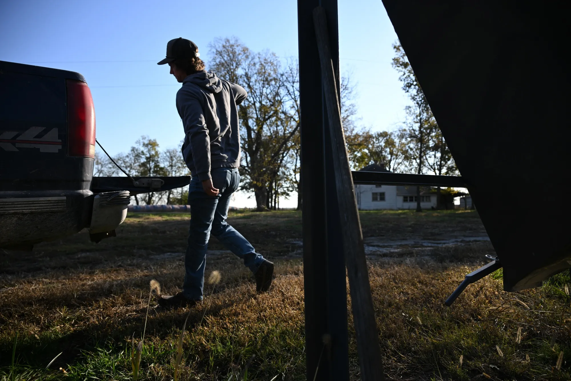 A farmer prepares feed for cattle at a farm near Montrose, Missouri in November.&nbsp;