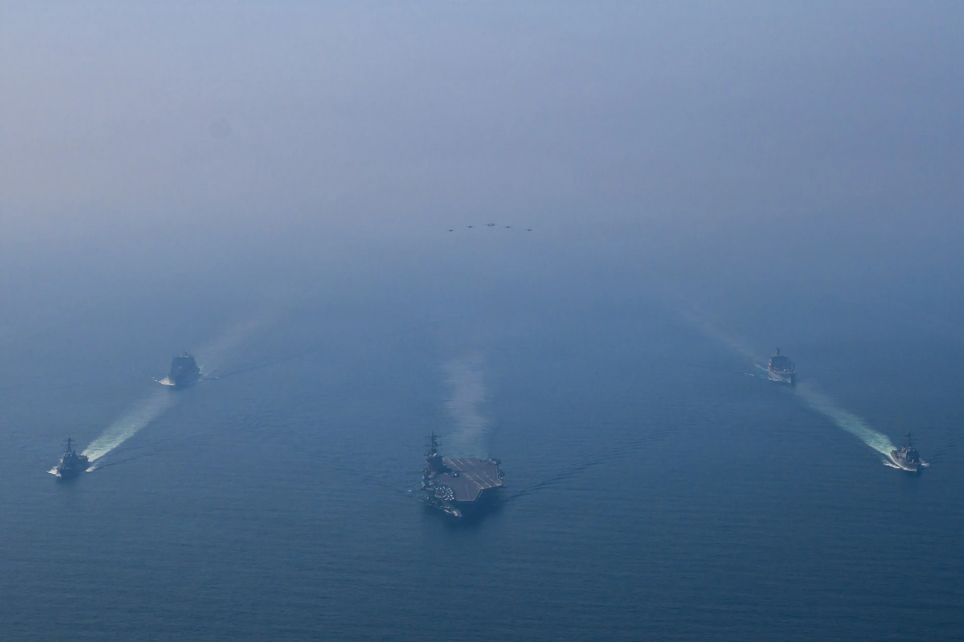 The USS Abraham Lincoln sails in formation with military ships in the Arabian Sea on Feb. 6, in an image provided by the US Navy.