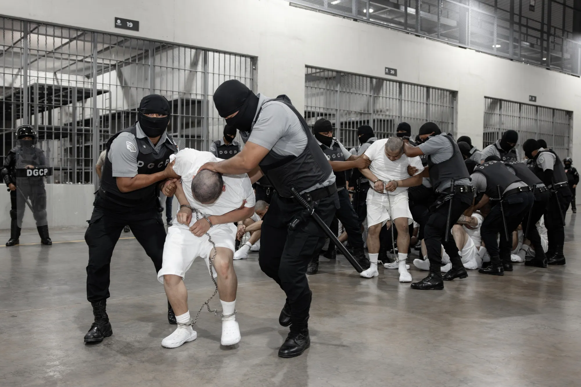 In this photo released by the El Salvador Presidency, suspected gang members arrive in El Salvador on March 16.