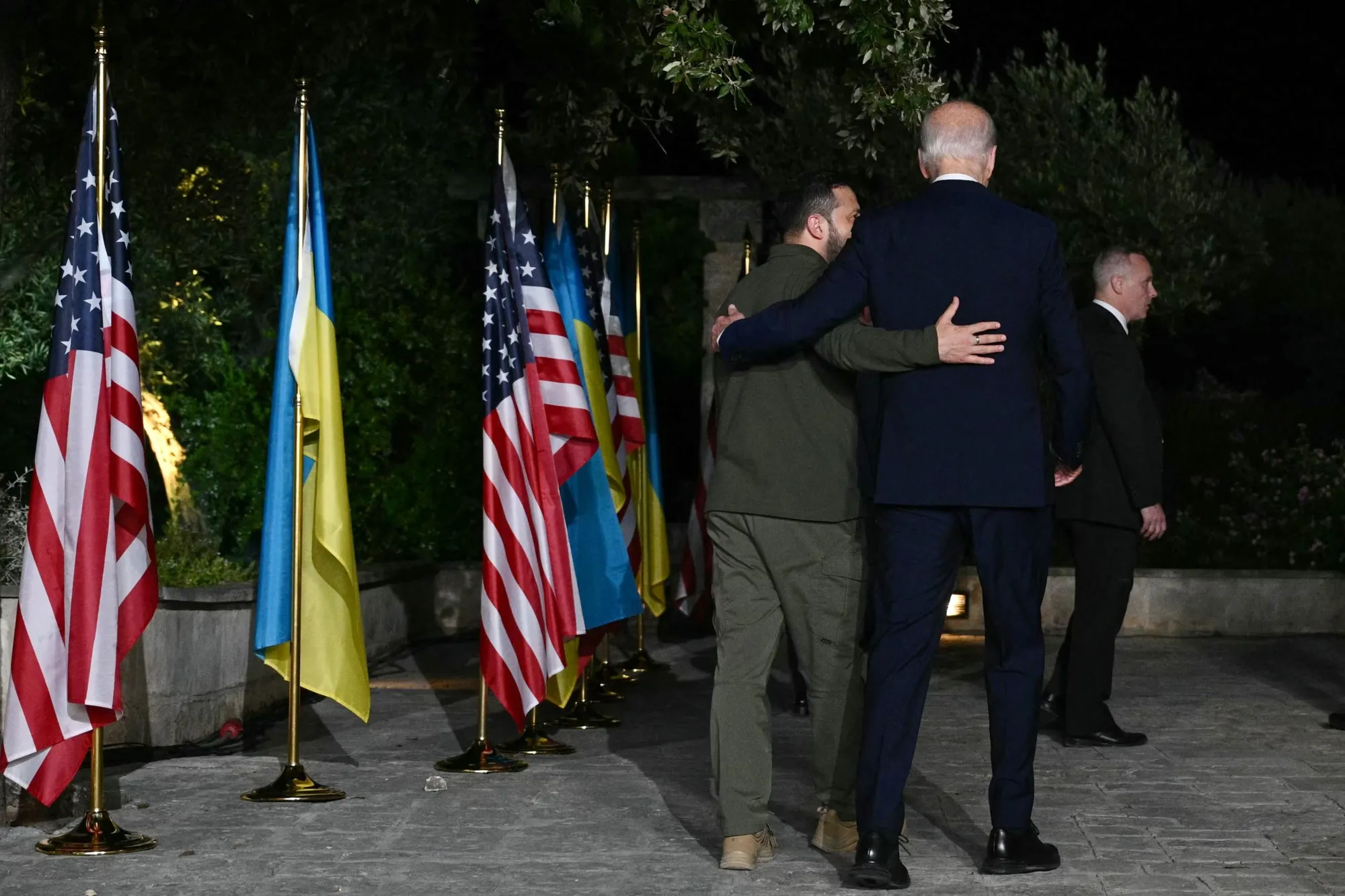 Volodymyr Zelenskiy and Joe Biden leave after signing a security agreement on the sidelines of the G7 Summit&nbsp;in Savelletri, Italy on June 13.