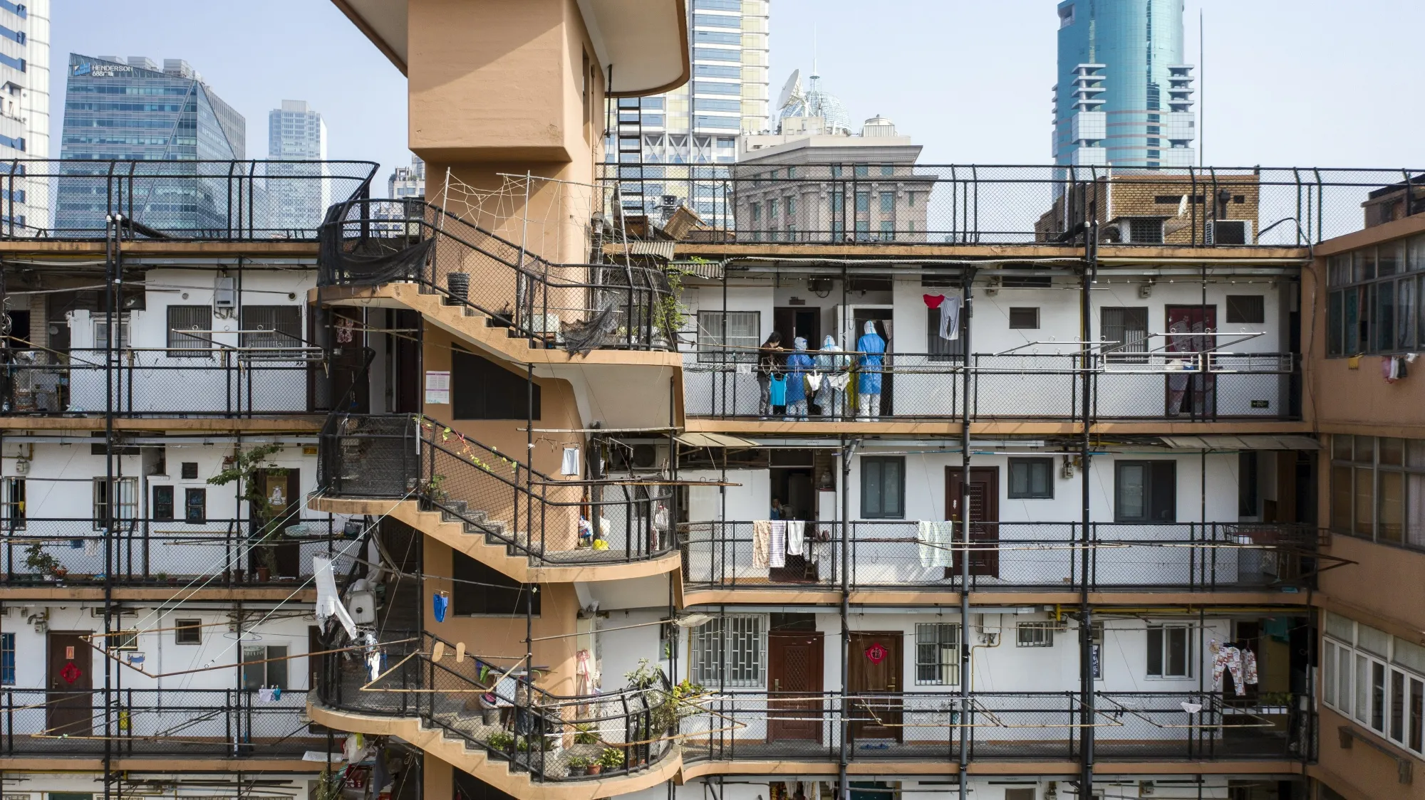 Quarantine workers in personal protective equipment at a residential building during&nbsp;lockdown in Shanghai.