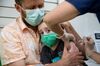 A healthcare worker administers a dose of the Moderna Covid-19 vaccine to a 3 year-old child in New York on June 23. Photographer: Michael Nagle/Bloomberg