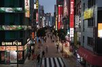 Pedestrians pass retail outlets in the Shinjuku District of Tokyo, Japan, on Monday, March 22, 2021. Japan ended the state of emergency in the Tokyo region Sunday, just days before the torch relay begins on March 25 for the virus-delayed Tokyo Olympics, now scheduled to start in July.