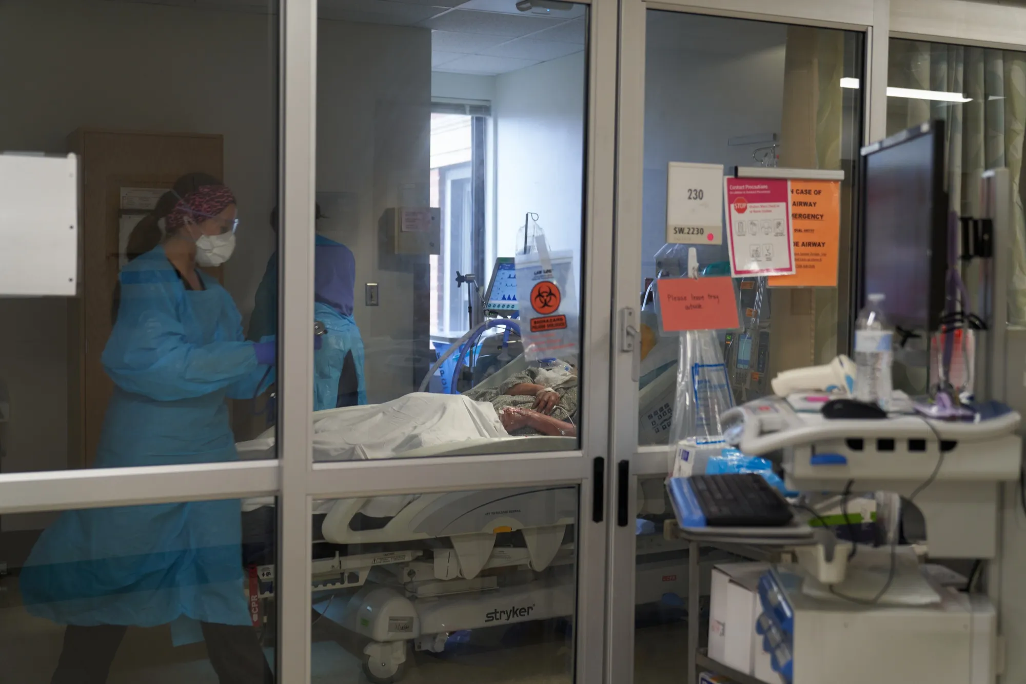 Healthcare workers treat a patient on the Covid-19 ICU floor of the University of Massachusetts (UMass) Memorial Hospital in Worcester, Massachusetts, U.S., on Dec. 27.
