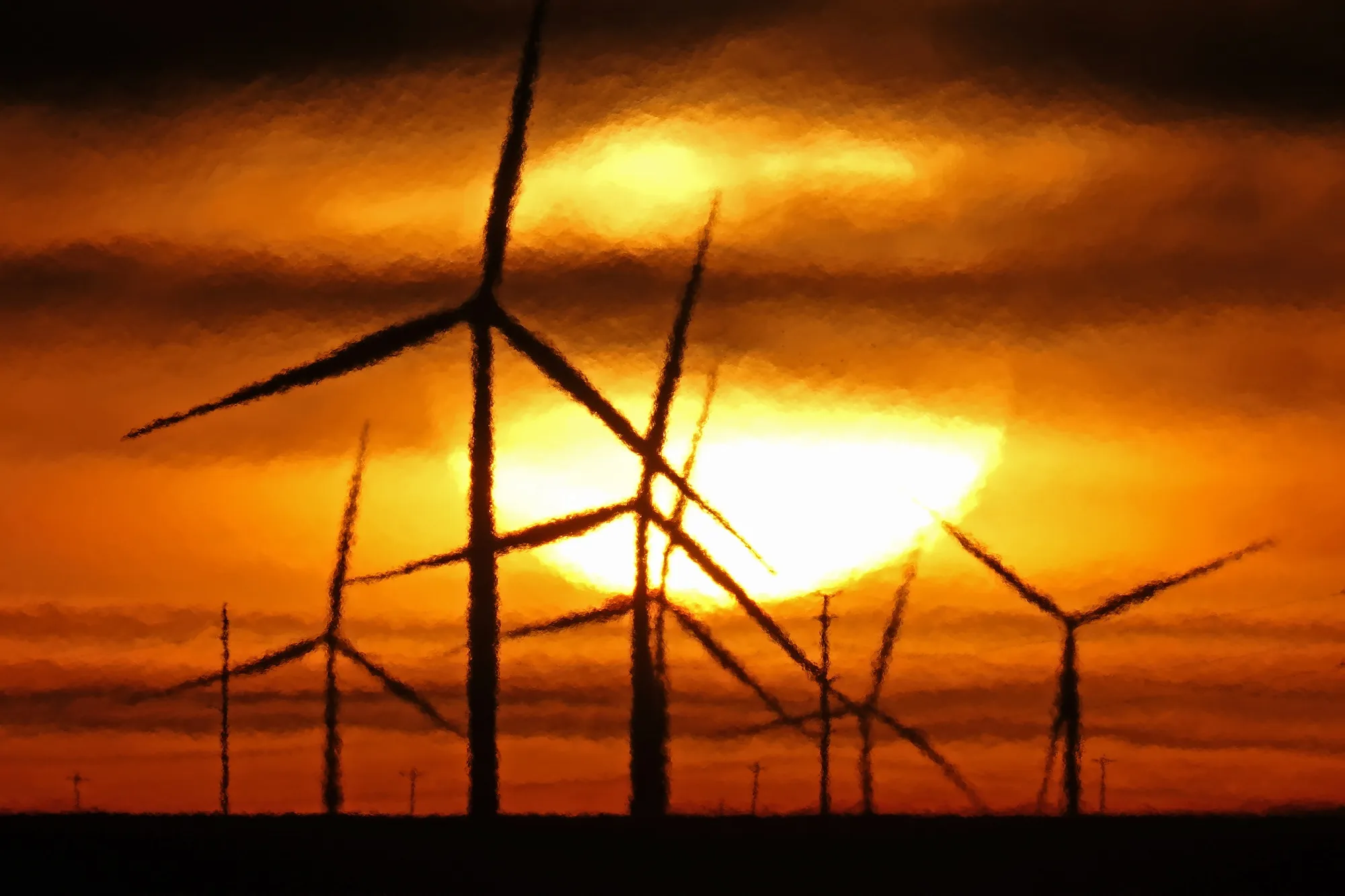 Wind turbines are silhouetted against the rising sun Wednesday, Jan. 13, 2021, near Spearville, Kan.  A new study released on Wednesday, April 13, 2022, finds that if the nations of the world live up to their promises, future climate climate change can be limited to the weaker of two international goals. According to a study, the world is potentially on track to keep global warming at or a shade below 2 degrees Celsius (3.6 degrees Fahrenheit) hotter than pre-industrial times, a goal that once seemed out of reach (AP Photo/Charlie Riedel, File)