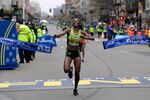 Caroline Rotich, of Kenya, breaks the tape to win the women's division of the Boston Marathon, on Monday, April 20, 2015 in Boston.

