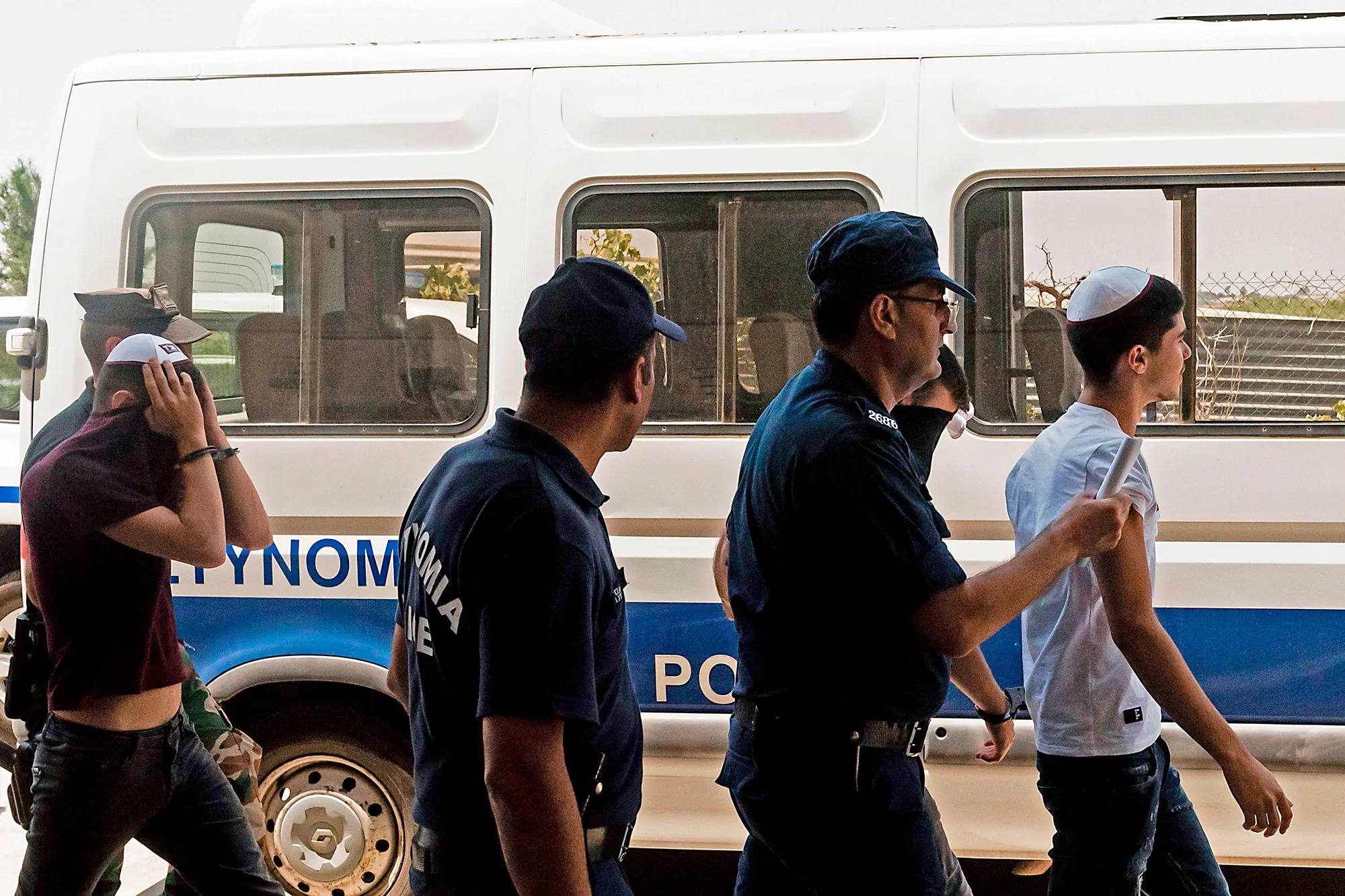 Israeli teenagers leave the court after a hearing in the eastern Cypriot resort of Paralimni on July 26.&nbsp;