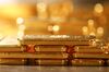 One kilogram fine gold bars sit stacked in the precious metals vault at Pro Aurum KG in Munich, Germany, on Wednesday, July 10, 2019. Gold rose for a third day after the Federal Reserve indicated that it’s preparing to cut interest rates for the first time in a decade as the global economy slows.