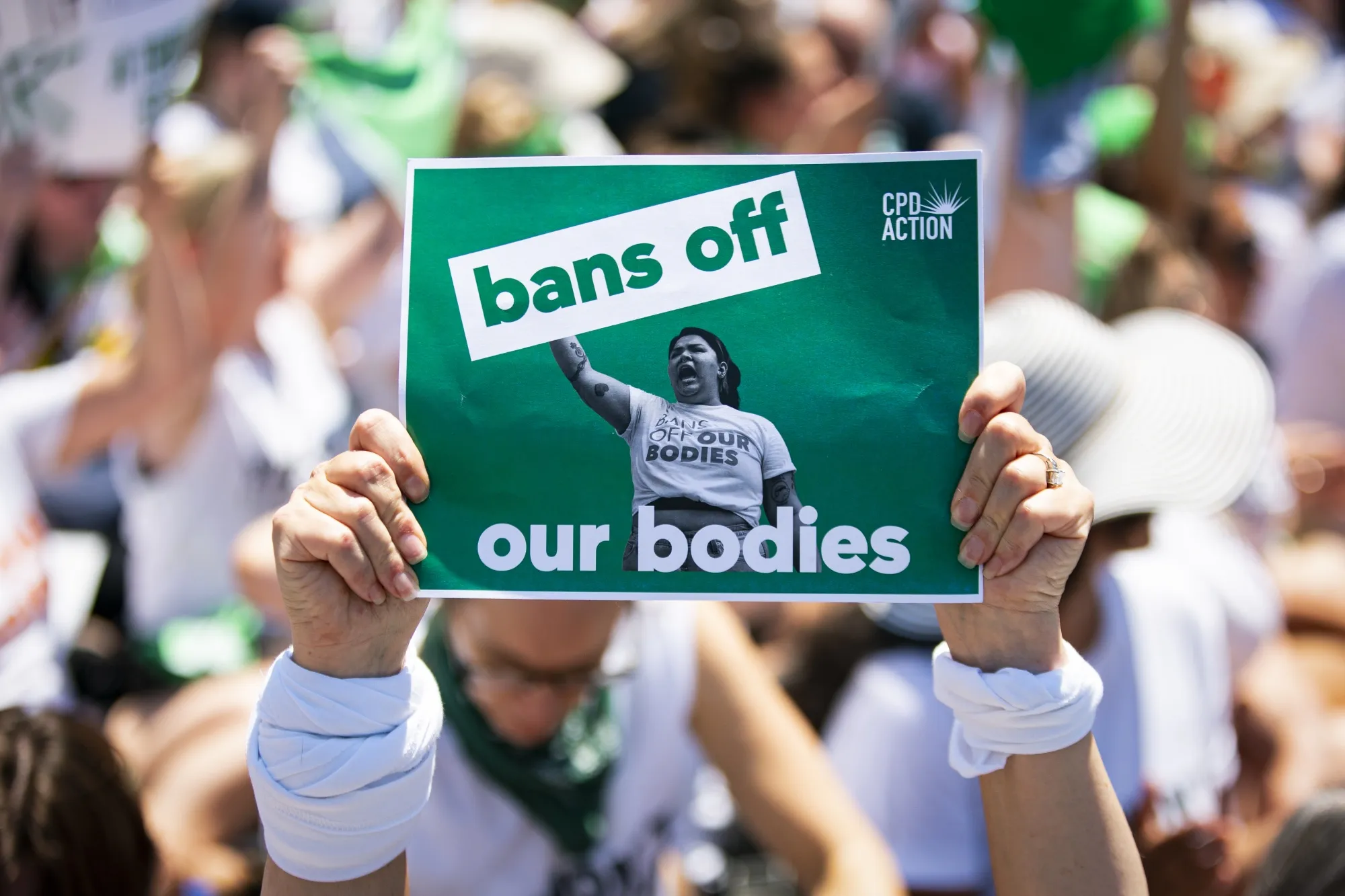 An abortion rights demonstrator holds a "bans off our bodies" sign while blocking an intersection during a protest near the US Supreme Court in Washington, D.C., US, on Thursday, June 30, 2022.