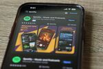 NEW YORK, NEW YORK - JUNE 04: In this photo illustration, the Spotify music app is seen on a phone on June 04, 2024 in New York City. Spotify made an announcement that it will be raising the price of its Spotify Premium Individual plan by $1, from $10.99 to $11.99 per month and the Premium Family plan by $3, from $16.99 to $19.99 per month. (Photo Illustration by Michael M. Santiago/Getty Images)