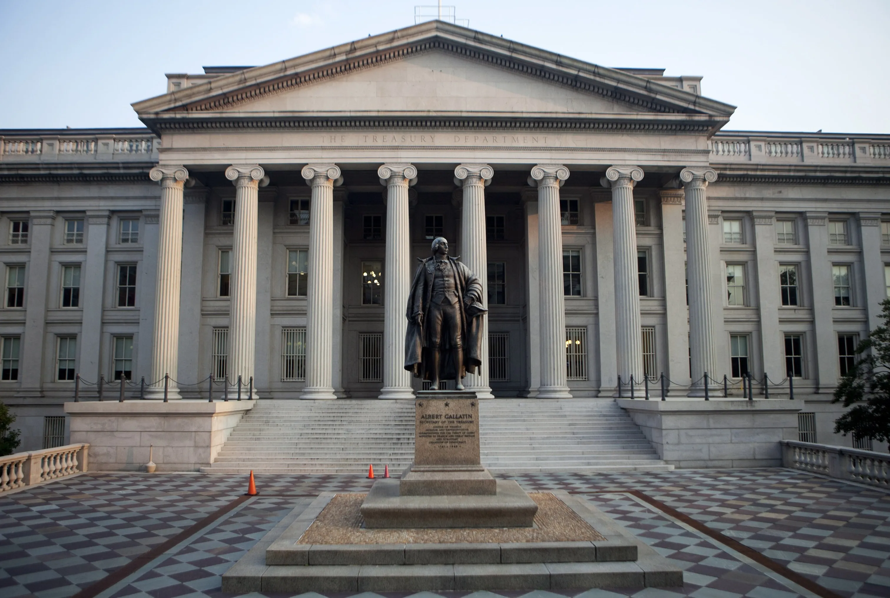 A statue of Albert Gallatin stands outside the U.S. Department of the Treasury building stands in Washington, D.C., U.S., on Friday, July 29, 2011. President Barack Obama and congressional leaders began a fresh attempt to reach agreement on raising the U.S. debt cap, with a potential framework for a deal emerging two days before a default deadline.