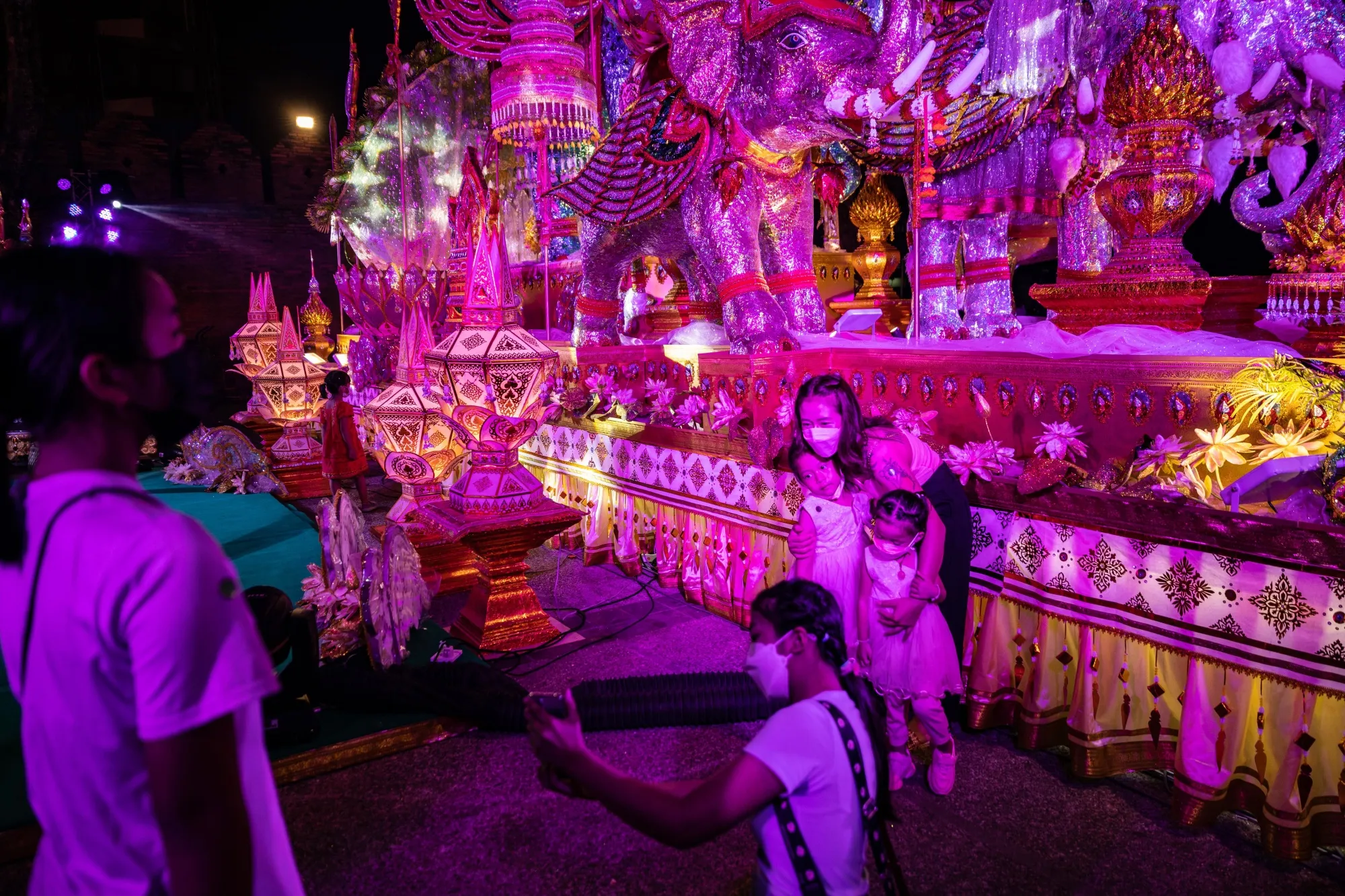 Visitors take photos at Tha Phae Gate during the Loy Krathong festival in Chiang Mai on Nov. 19.