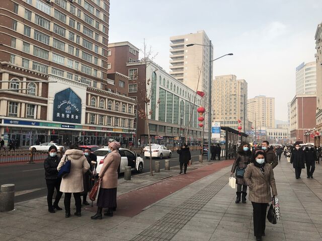 Residents stop for a chat nearby the Xinjiang International Grand Bazaar in downtown Urumqi.