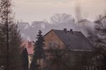 Smoke rises from household chimneys in the suburbs of Krakow, Poland.