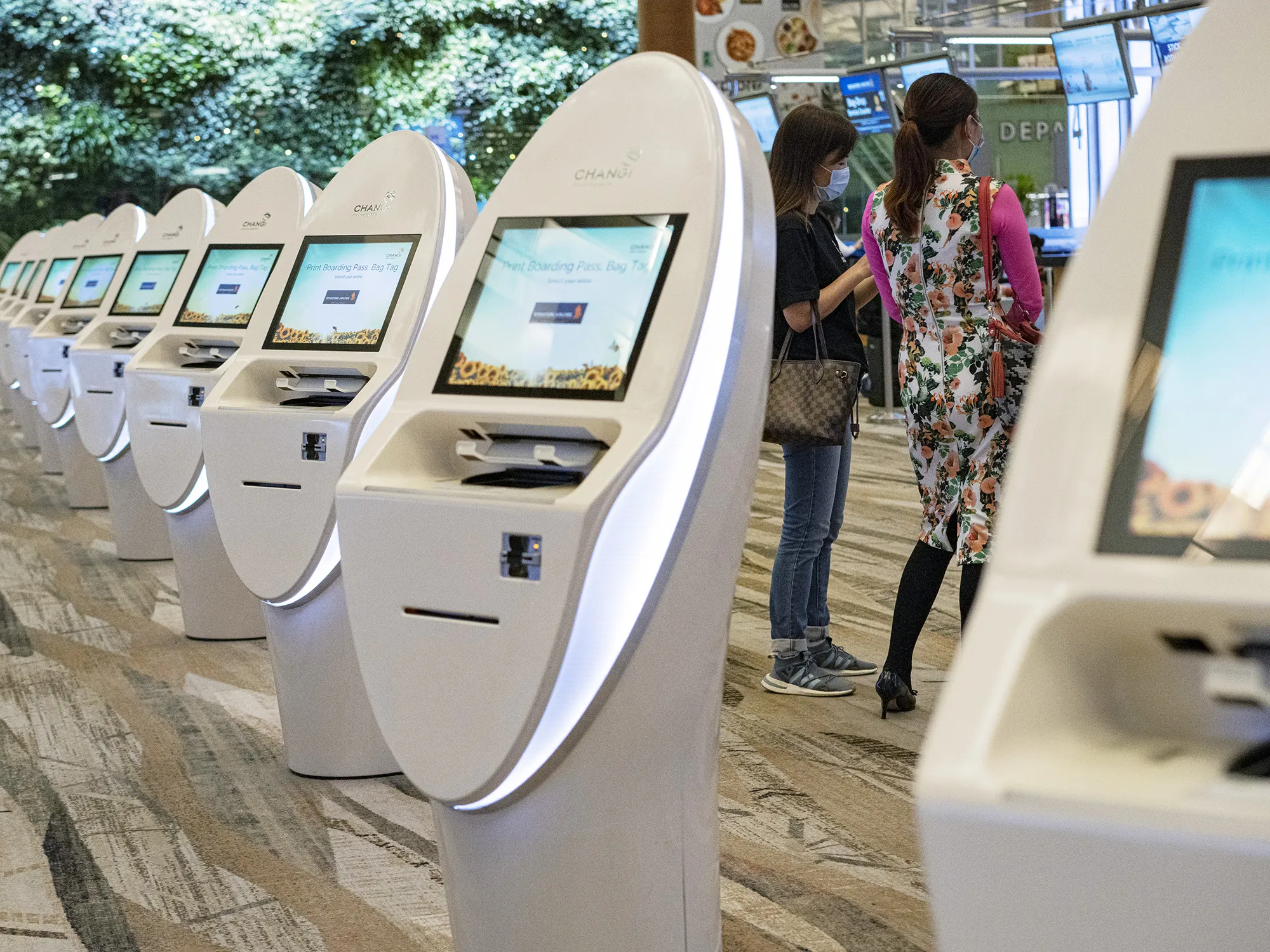 Passengers inside the departure hall of Changi Airport in Singapore, on March 22.