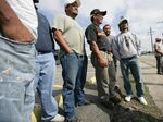 Latino day laborers waiting for their next job in Metarie, Louisiana.