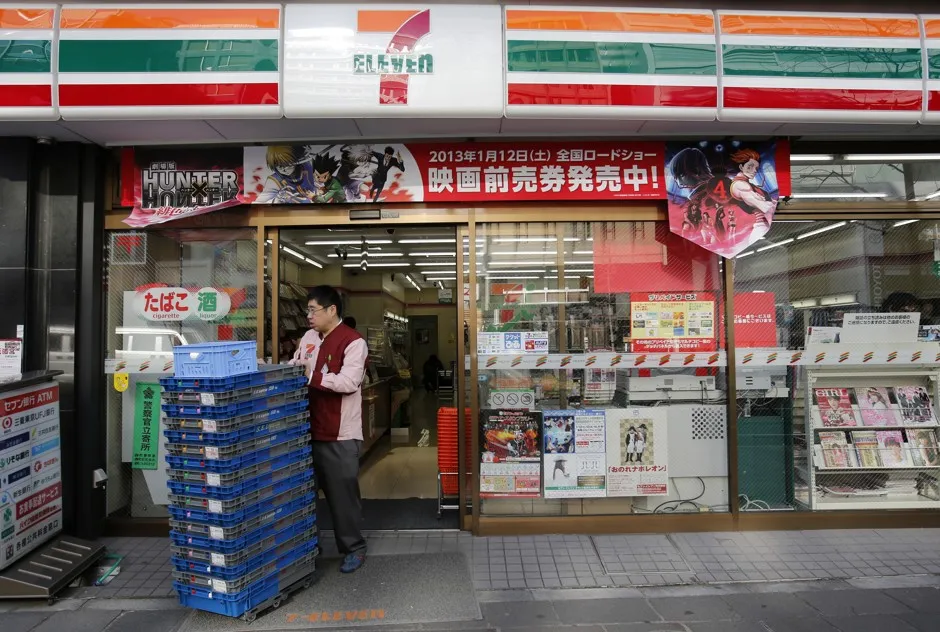 A 7-Eleven employee works in a Tokyo branch. 