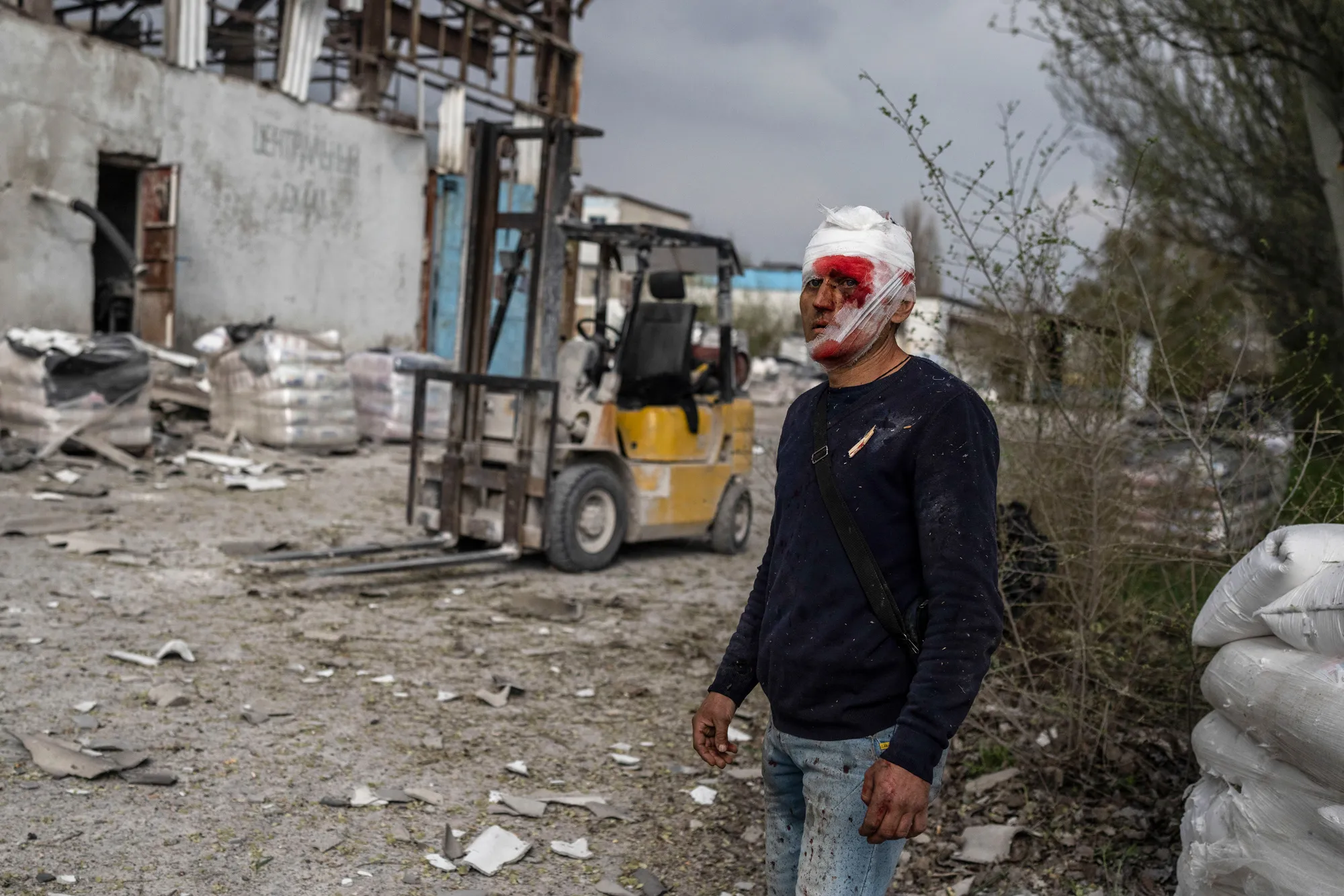 An injured man&nbsp;following a Russian strike on a factory in Kramatorsk,&nbsp;eastern Ukraine.