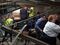 Passengers exit a NJ Transit train after it crashed at the Hoboken Terminal on Sept. 29. Photographer: Pancho Bernasconi/Getty Images