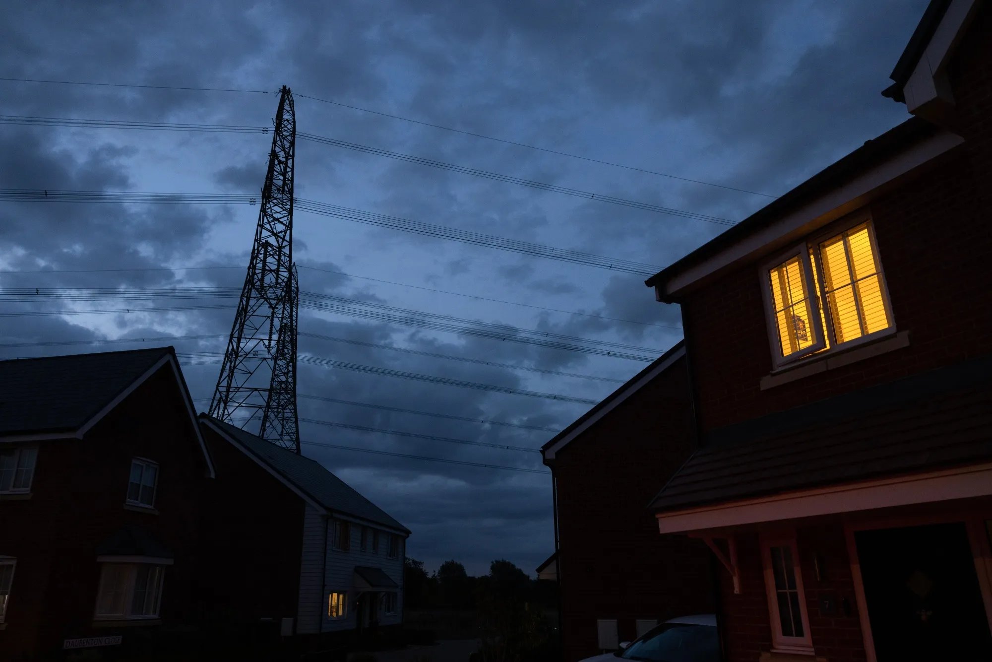 A new home near to an electricity pylon in Bramford, UK.